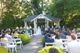 Seated guests watching ceremony in outdoor chapel.