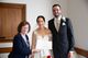 Sylvie with the bride and groom holding the marriage certificate.