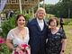 Sylvie posing with the bride and groom.